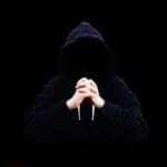 Man in the middle cyber attack hacker on a black background