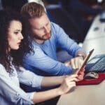 Programmers involved in disaster recovery planning in an IT office setting