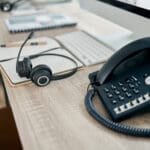 VoIP phone system on desk of remote worker