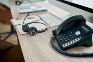 VoIP phone system on desk of remote worker